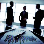 http://www.dreamstime.com/stock-photography-business-trio-shadowy-holding-briefing-concerning-reported-statistic-data-image33941802