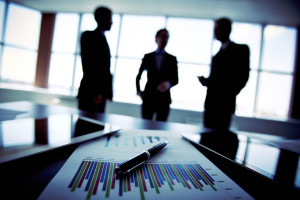http://www.dreamstime.com/stock-photography-business-trio-shadowy-holding-briefing-concerning-reported-statistic-data-image33941802